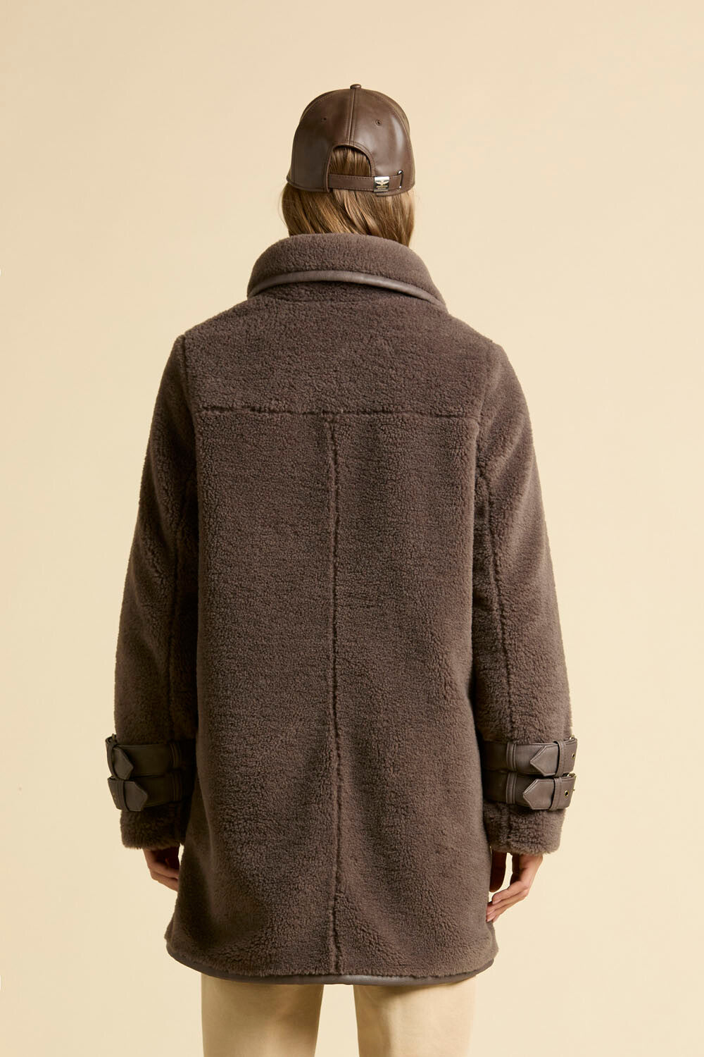 Faux fur coat with leather-effect detail