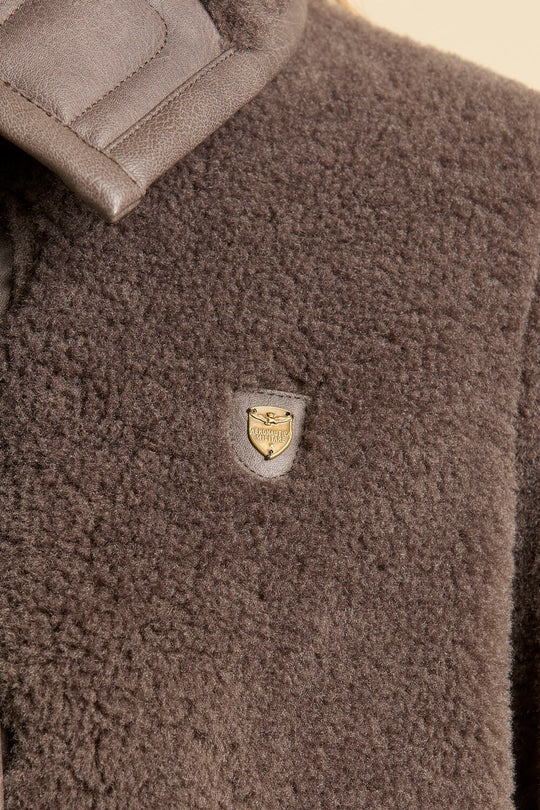 Faux fur coat with leather-effect detail