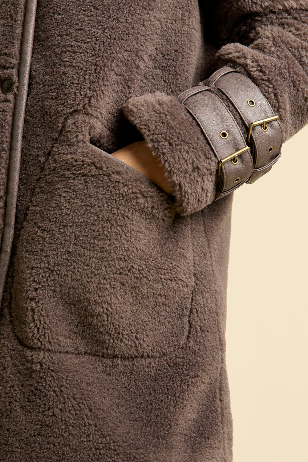 Faux fur coat with leather-effect detail