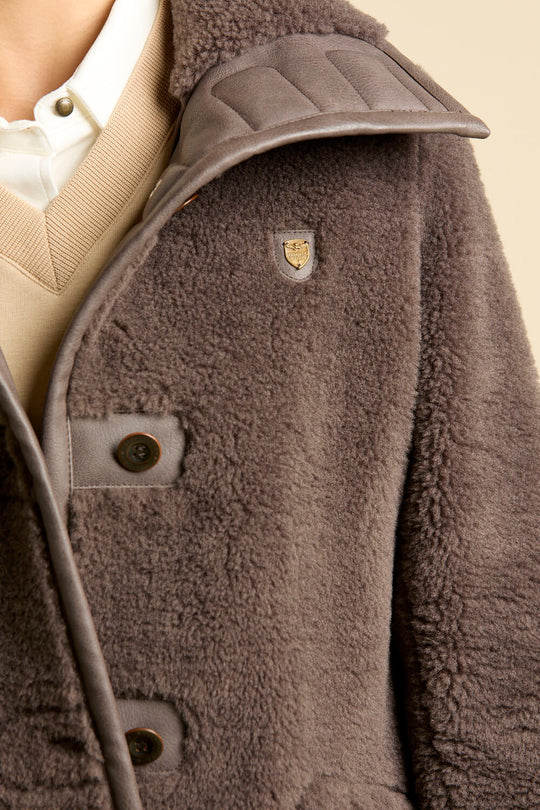 Faux fur coat with leather-effect detail