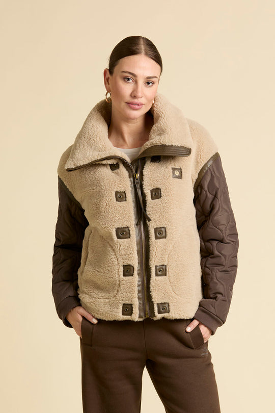 Faux fur coat with quilted sleeves