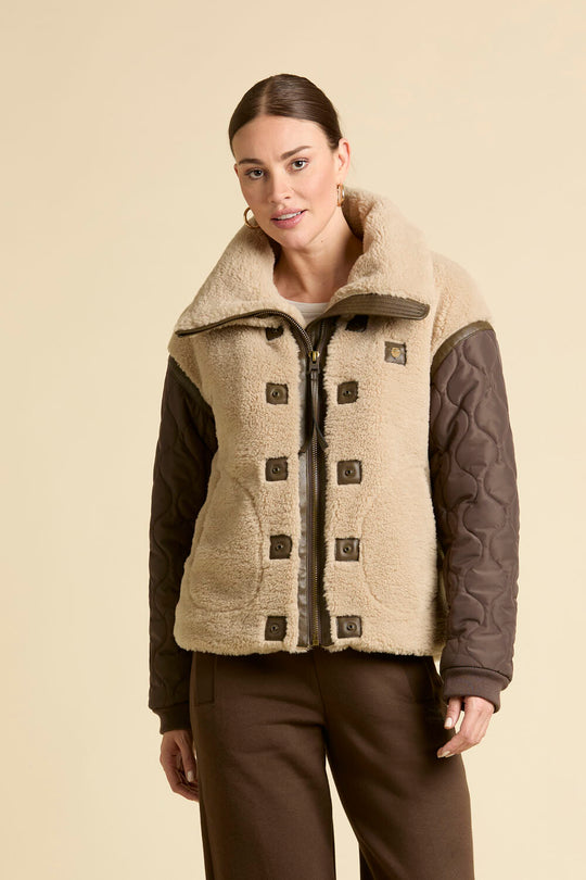 Faux fur coat with quilted sleeves