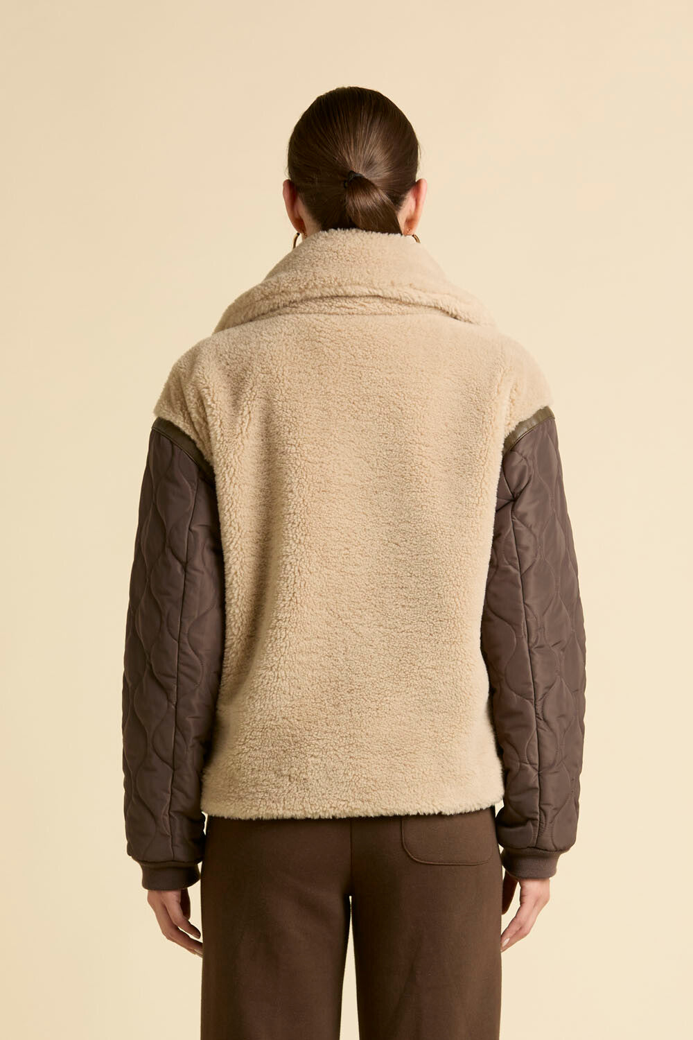 Faux fur coat with quilted sleeves