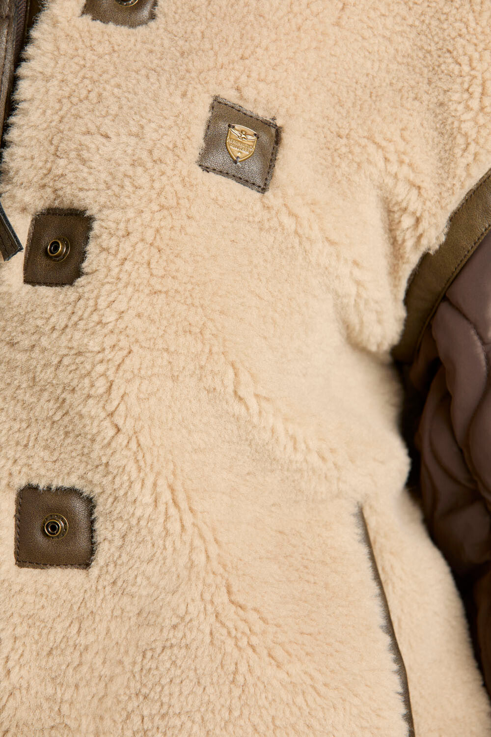 Faux fur coat with quilted sleeves