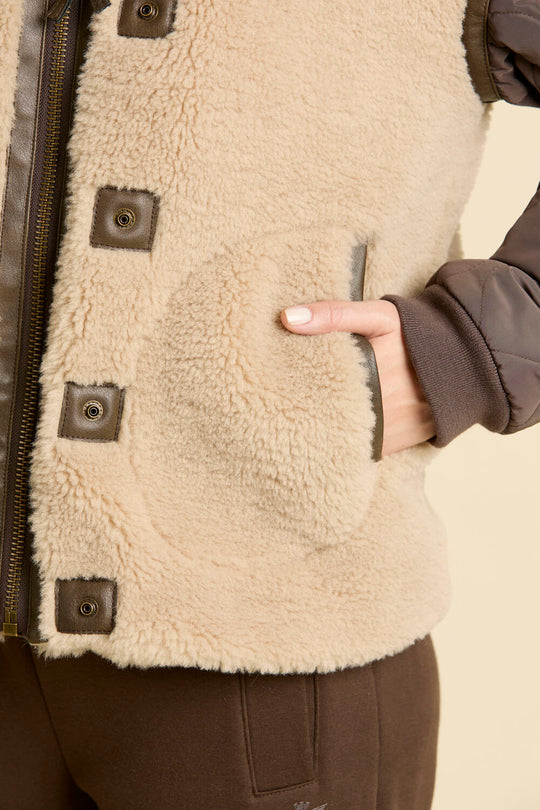 Faux fur coat with quilted sleeves