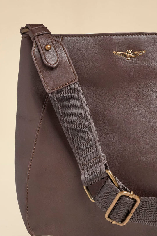 Shoulder bag with perforated logo