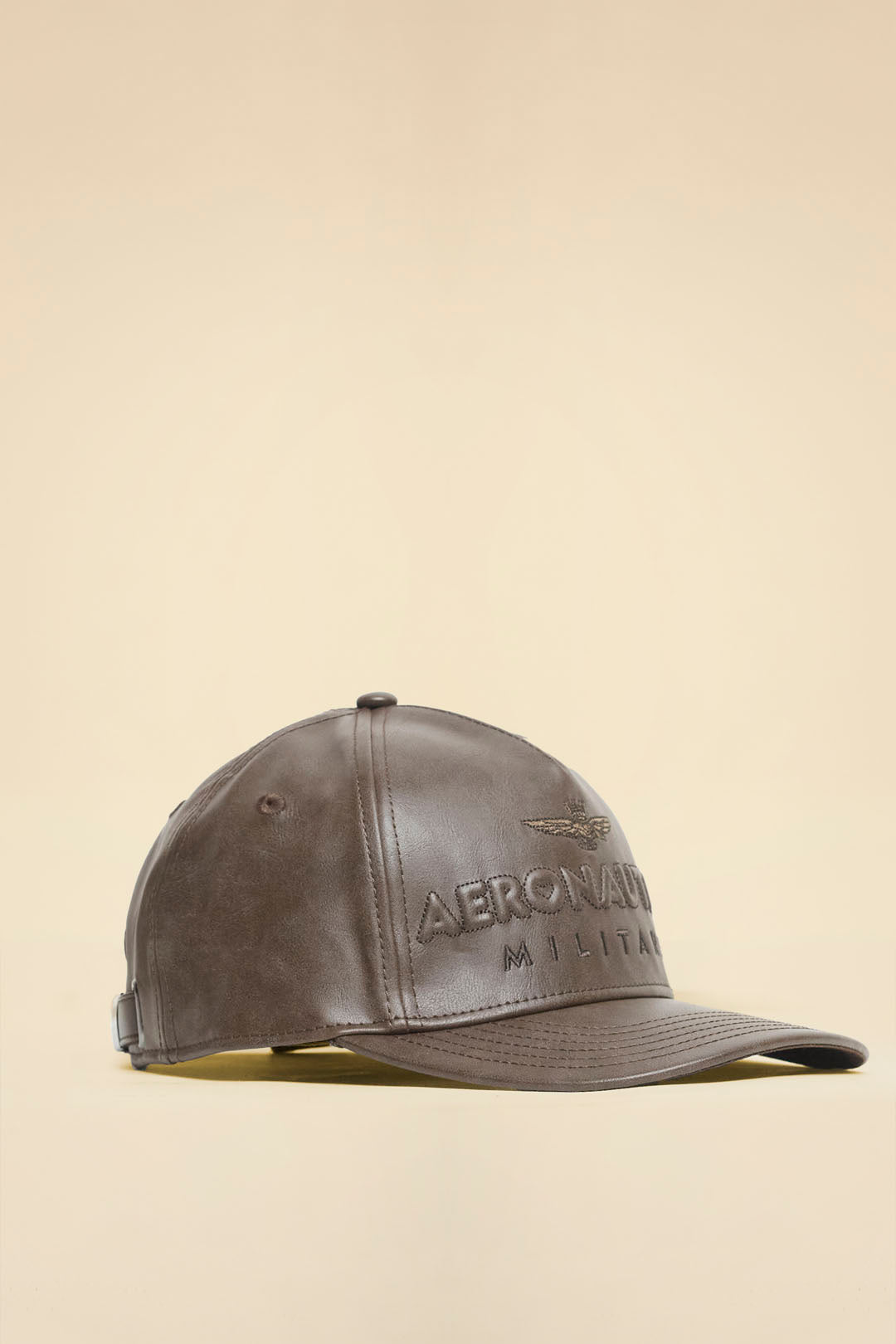 Faux leather cap with embossed logo