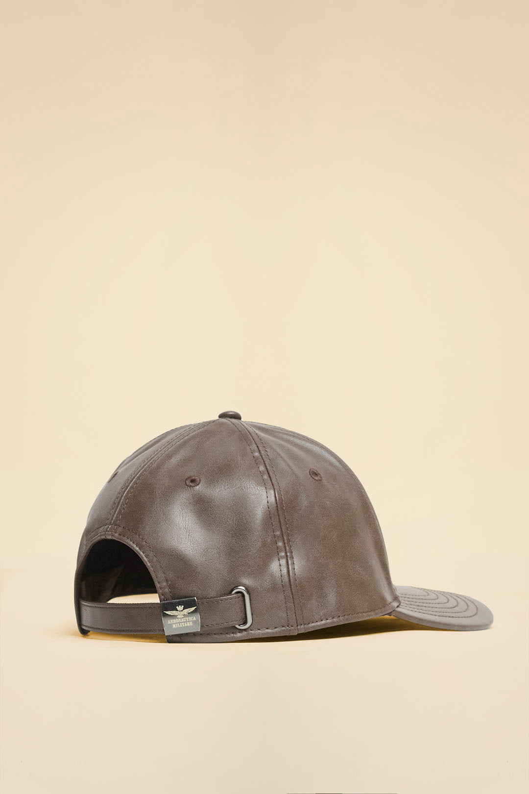 Faux leather cap with embossed logo
