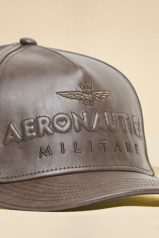 Faux leather cap with embossed logo