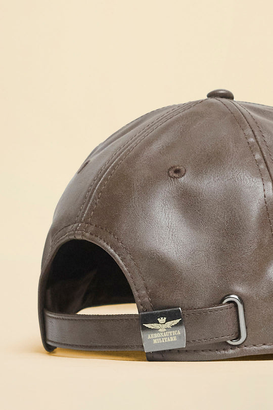 Faux leather cap with embossed logo